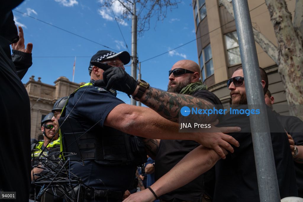 MELBOURNE, AUSTRALIA, SEPTEMBER 19, 2026: Transgender rights supporters demonstrate outside the Parliament of Victoria in Melbourne amid a heavy police presence. Tensions rise as protesters confront bodyguards accompanying Avi Yemini while he attempts to interview people opposing the demonstration. Photo by Braden Nam / JNA Press. (Photo by Taemin Braden Nam/JNA Press via Nexpher Images)