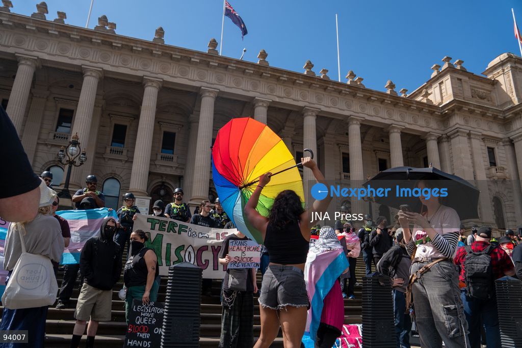 MELBOURNE, AUSTRALIA, SEPTEMBER 19, 2026: Transgender rights supporters demonstrate outside the Parliament of Victoria in Melbourne amid a heavy police presence. Tensions rise as protesters confront bodyguards accompanying Avi Yemini while he attempts to interview people opposing the demonstration. Photo by Braden Nam / JNA Press. (Photo by Taemin Braden Nam/JNA Press via Nexpher Images)