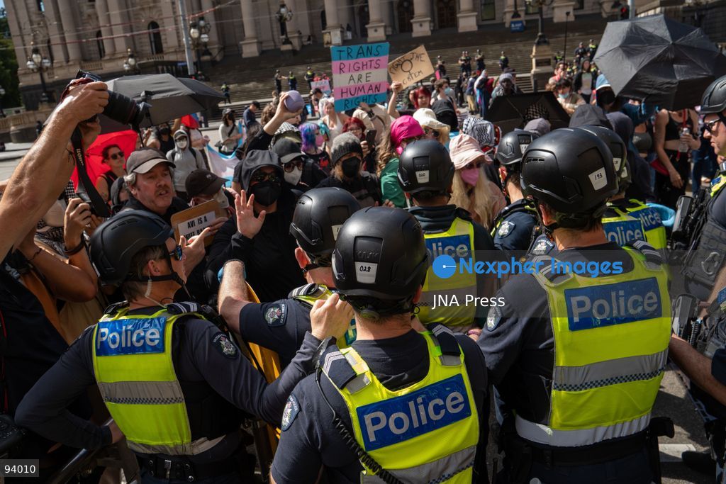 MELBOURNE, AUSTRALIA, SEPTEMBER 19, 2026: Transgender rights supporters demonstrate outside the Parliament of Victoria in Melbourne amid a heavy police presence. Tensions rise as protesters confront bodyguards accompanying Avi Yemini while he attempts to interview people opposing the demonstration. Photo by Braden Nam / JNA Press. (Photo by Taemin Braden Nam/JNA Press via Nexpher Images)