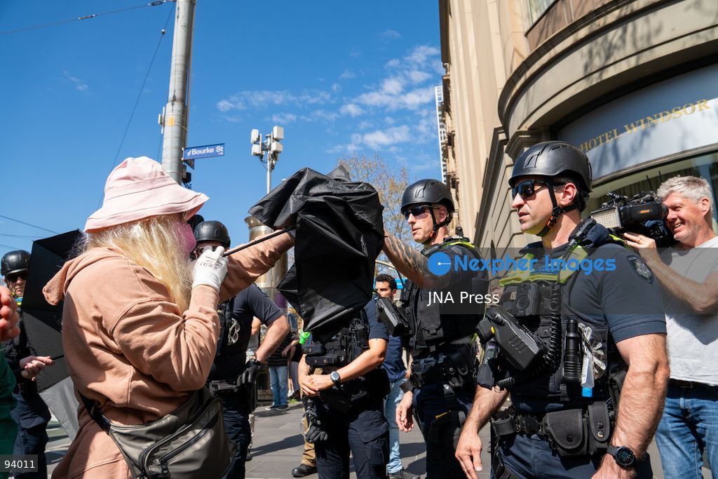 MELBOURNE, AUSTRALIA, SEPTEMBER 19, 2026: Transgender rights supporters demonstrate outside the Parliament of Victoria in Melbourne amid a heavy police presence. Tensions rise as protesters confront bodyguards accompanying Avi Yemini while he attempts to interview people opposing the demonstration. Photo by Braden Nam / JNA Press. (Photo by Taemin Braden Nam/JNA Press via Nexpher Images)