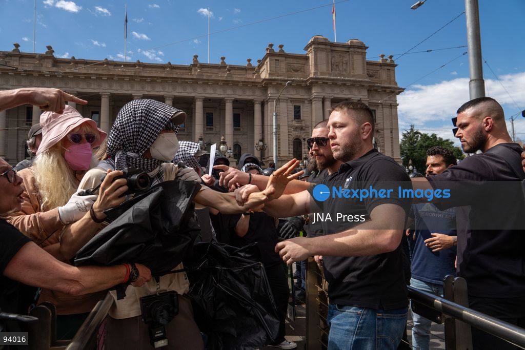 MELBOURNE, AUSTRALIA, SEPTEMBER 19, 2026: Transgender rights supporters demonstrate outside the Parliament of Victoria in Melbourne amid a heavy police presence. Tensions rise as protesters confront bodyguards accompanying Avi Yemini while he attempts to interview people opposing the demonstration. Photo by Braden Nam / JNA Press. (Photo by Taemin Braden Nam/JNA Press via Nexpher Images)