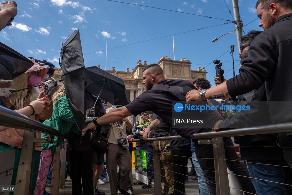 MELBOURNE, AUSTRALIA, SEPTEMBER 19, 2026: Transgender rights supporters demonstrate outside the Parliament of Victoria in Melbourne amid a heavy police presence. Tensions rise as protesters confront bodyguards accompanying Avi Yemini while he attempts to interview people opposing the demonstration. Photo by Braden Nam / JNA Press. (Photo by Taemin Braden Nam/JNA Press via Nexpher Images)