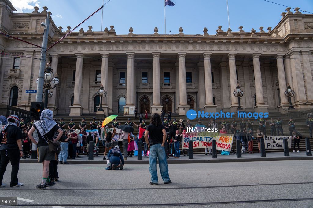 MELBOURNE, AUSTRALIA, SEPTEMBER 19, 2026: Transgender rights supporters demonstrate outside the Parliament of Victoria in Melbourne amid a heavy police presence. Tensions rise as protesters confront bodyguards accompanying Avi Yemini while he attempts to interview people opposing the demonstration. Photo by Braden Nam / JNA Press. (Photo by Taemin Braden Nam/JNA Press via Nexpher Images)