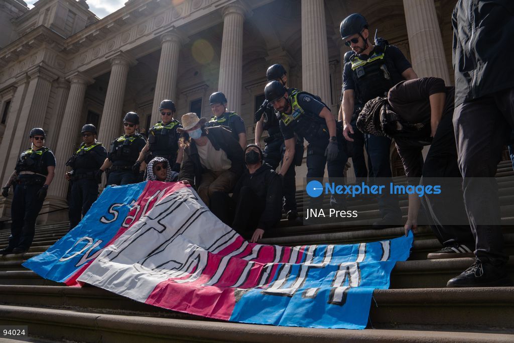 MELBOURNE, AUSTRALIA, SEPTEMBER 19, 2026: Transgender rights supporters demonstrate outside the Parliament of Victoria in Melbourne amid a heavy police presence. Tensions rise as protesters confront bodyguards accompanying Avi Yemini while he attempts to interview people opposing the demonstration. Photo by Braden Nam / JNA Press. (Photo by Taemin Braden Nam/JNA Press via Nexpher Images)