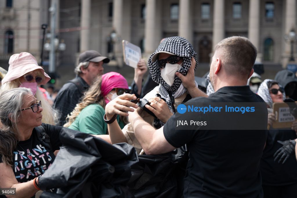 MELBOURNE, AUSTRALIA, SEPTEMBER 19, 2026: Police separate opposing groups during demonstrations outside the Parliament of Victoria in Melbourne, where a group describing itself as a women’s rights movement gathered to oppose legal protections for transgender people and was met by transgender rights counter-protesters. Tensions escalated when Avi Yemini of the right-wing outlet Rebel News approached the counter-protest and became involved in a confrontation with demonstrators before police intervened and separated those involved. Photo by Gwendolyn Dilon / JNA Press. (Photo by Gwendolyn Dillon/JNA Press via Nexpher Images)