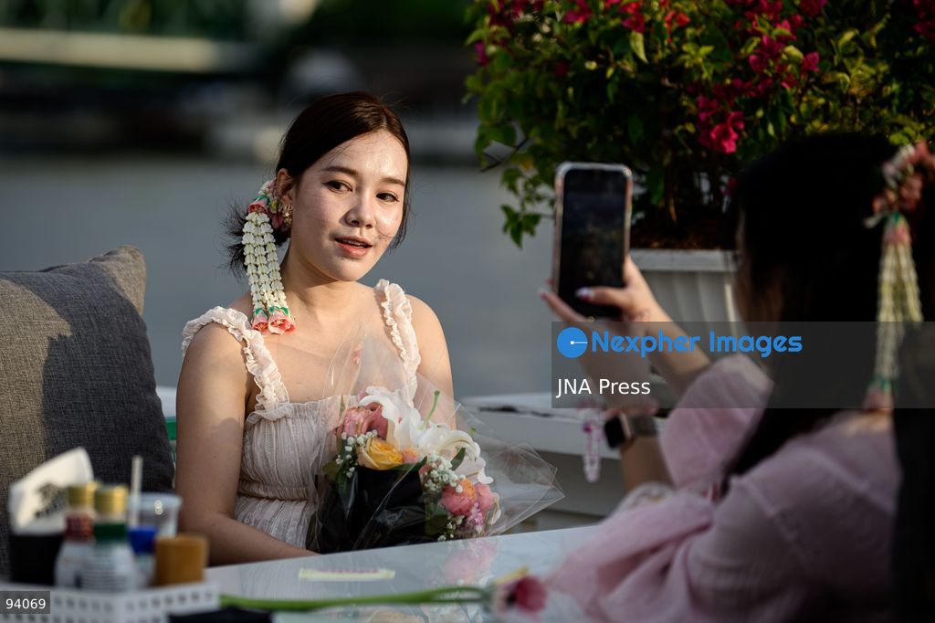 BANGKOK, THAILAND, SEPTEMBER 19, 2026: Visitors attend the Bangkok Flower Festival 2026 at Yodpiman River Walk in the Pak Khlong Talat flower market district along the Chao Phraya River. The inaugural festival, organized by Awakening and Yodpiman River Walk, features floral displays, art exhibitions, workshops, markets and food-related activities. The 10-day event runs from September 18 to 27. Photo by Watsawat Koktabtim / JNA Press. (Photo by Watsawat Koktabtim/JNA Press via Nexpher Images)