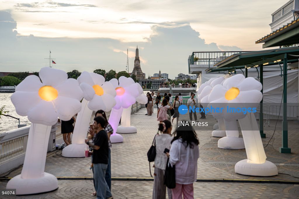 BANGKOK, THAILAND, SEPTEMBER 19, 2026: Visitors attend the Bangkok Flower Festival 2026 at Yodpiman River Walk in the Pak Khlong Talat flower market district along the Chao Phraya River. The inaugural festival, organized by Awakening and Yodpiman River Walk, features floral displays, art exhibitions, workshops, markets and food-related activities. The 10-day event runs from September 18 to 27. Photo by Watsawat Koktabtim / JNA Press. (Photo by Watsawat Koktabtim/JNA Press via Nexpher Images)