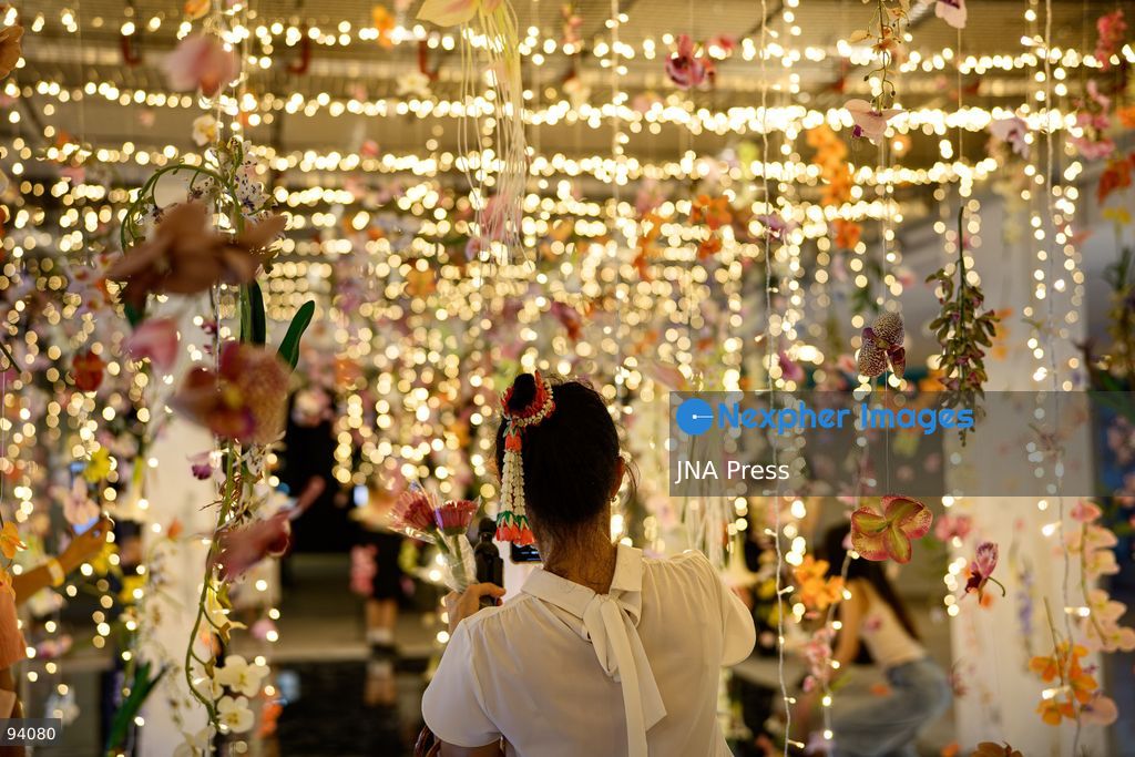 BANGKOK, THAILAND, SEPTEMBER 19, 2026: Visitors attend the Bangkok Flower Festival 2026 at Yodpiman River Walk in the Pak Khlong Talat flower market district along the Chao Phraya River. The inaugural festival, organized by Awakening and Yodpiman River Walk, features floral displays, art exhibitions, workshops, markets and food-related activities. The 10-day event runs from September 18 to 27. Photo by Watsawat Koktabtim / JNA Press. (Photo by Watsawat Koktabtim/JNA Press via Nexpher Images)
