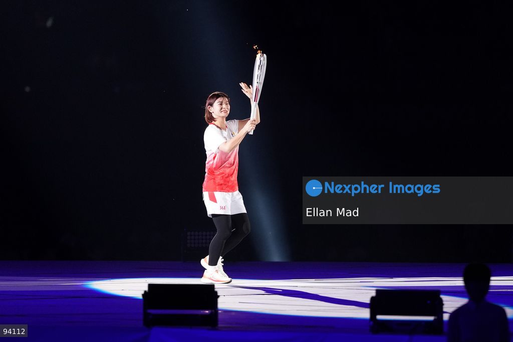 Ayaka Takahashi, retired Japanese badminton player holding the torch carrying the flame at the 2026 Asian Games opening ceremony on September 19, 2026 in Nagoya, Japan (Photo by Ellan Mad/Nexpher Images)