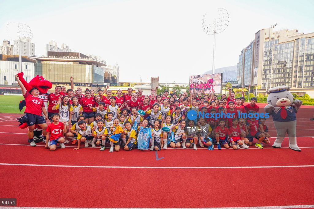 Players of the Hong Kong, China women's rugby team pose for a photograph with young fans following their 2026 WXV Global Series match against Fiji at Kai Tak Youth Sports Ground on September 19, 2026 in Hong Kong. (Photo by Zulu Lo/TMHK via Nexpher Images)