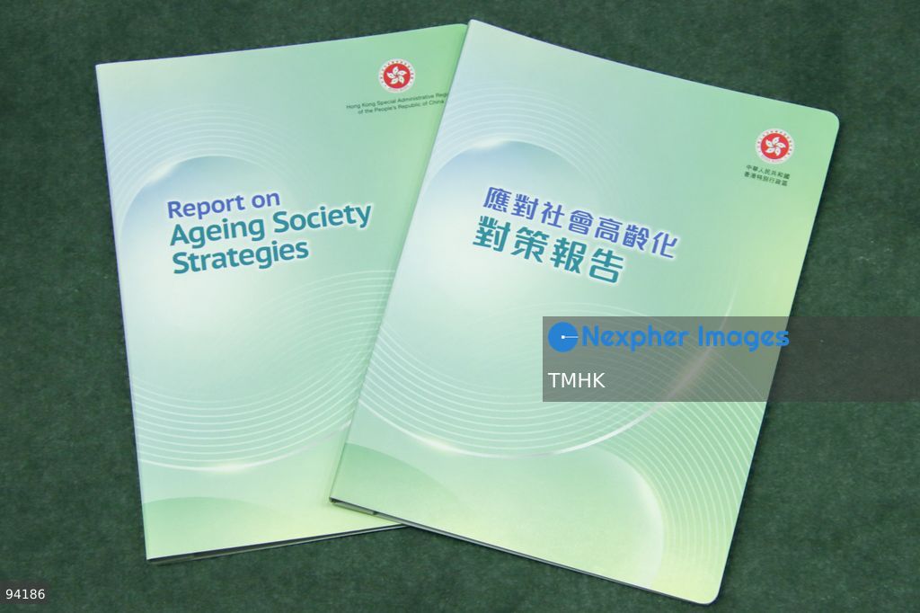 A close-up view shows the bilingual cover, divided equally between Traditional Chinese and English titles, of the "Report on Ageing Society Strategies" announced alongside the 2026 Policy Address initiatives on September 18, 2026 in Hong Kong. The report details cross-departmental blueprints including smart ageing technology, silver economy promotion, and enhanced residential and medical care for the elderly. (Photo by Gordon Choi/TMHK via Nexpher Images)