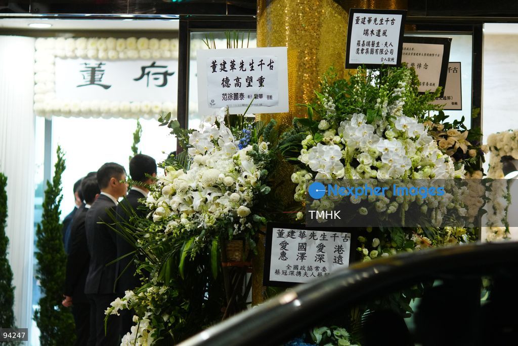 Floral wreaths and tributes sent by dignitaries and various sectors of the community line the entrance and pavement outside the Hong Kong Funeral Home during the wake for former Chief Executive Tung Chee-hwa on September 19, 2026 in Hong Kong. (Photo by Zulu Lo/TMHK via Nexpher Images)