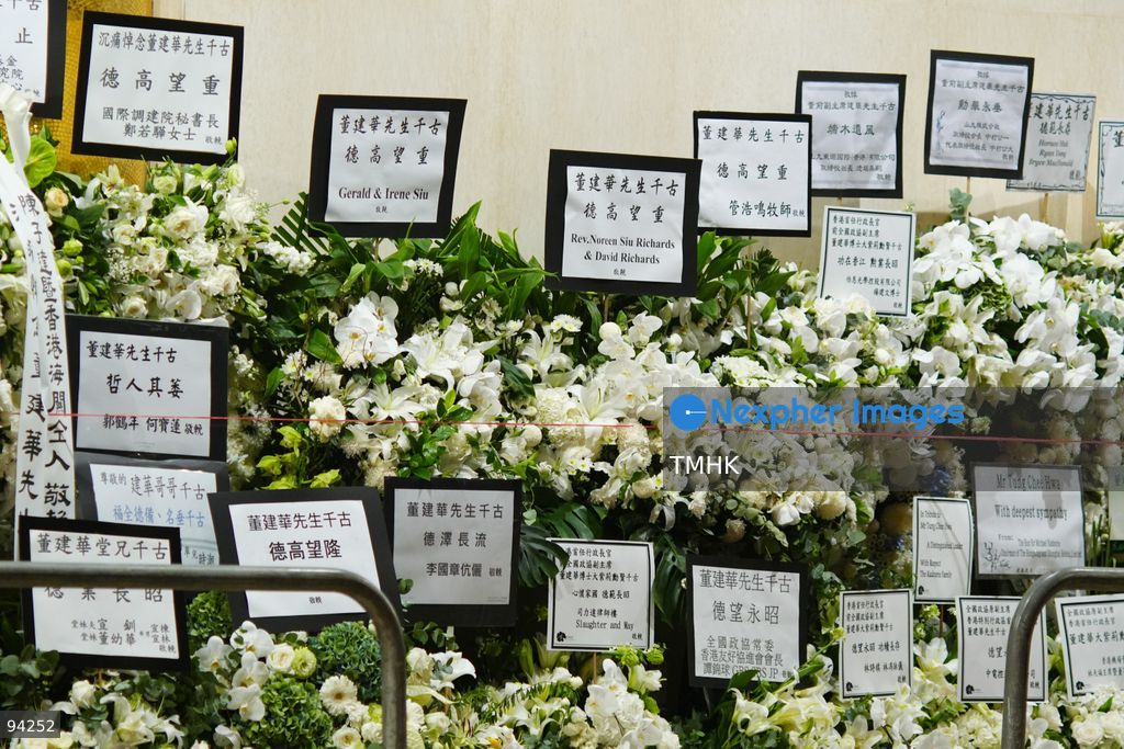 Floral wreaths and tributes sent by dignitaries and various sectors of the community line the entrance and pavement outside the Hong Kong Funeral Home during the wake for former Chief Executive Tung Chee-hwa on September 19, 2026 in Hong Kong. (Photo by Zulu Lo/TMHK via Nexpher Images)