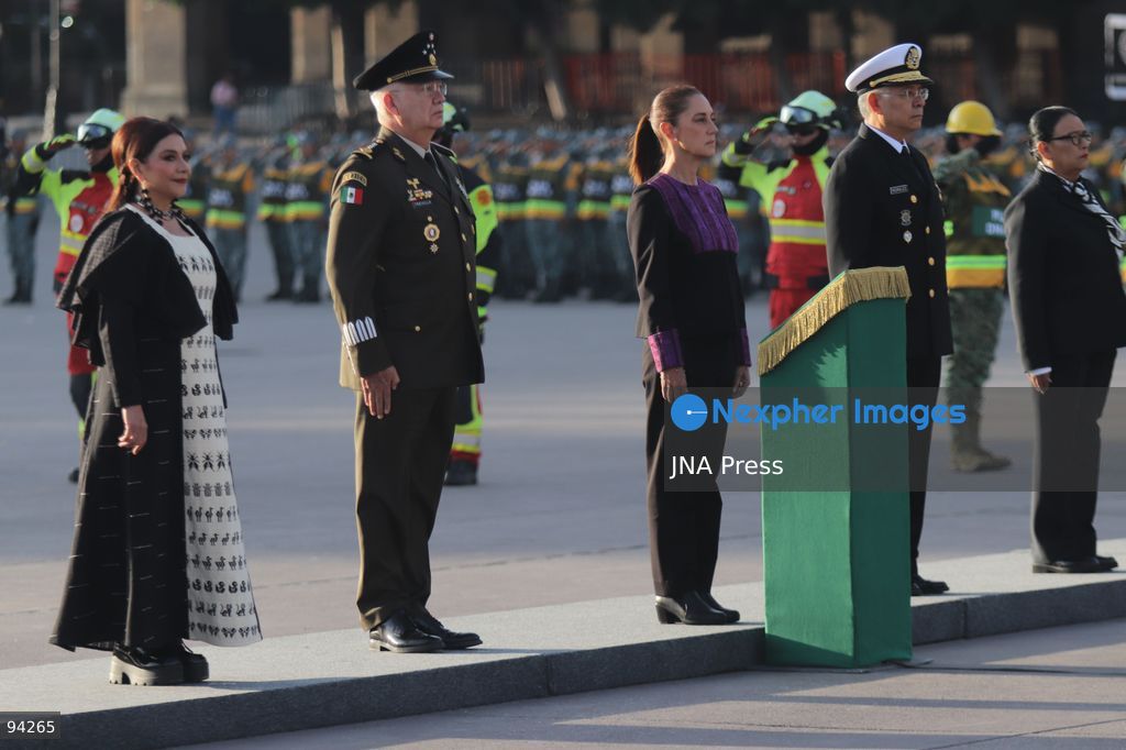 MEXICO CITY, MEXICO, SEPTEMBER 19, 2026: Mexican President Claudia Sheinbaum presides over a ceremony at the Zócalo in Mexico City as the national flag is raised to half-staff in memory of the victims of the September 19 earthquakes of 1985 and 2017. The ceremony included military honors and a moment of silence for those killed in the disasters. Photo by Carlos Santiago / JNA Press. (Photo by Carlos Santiago/JNA Press via Nexpher Images)