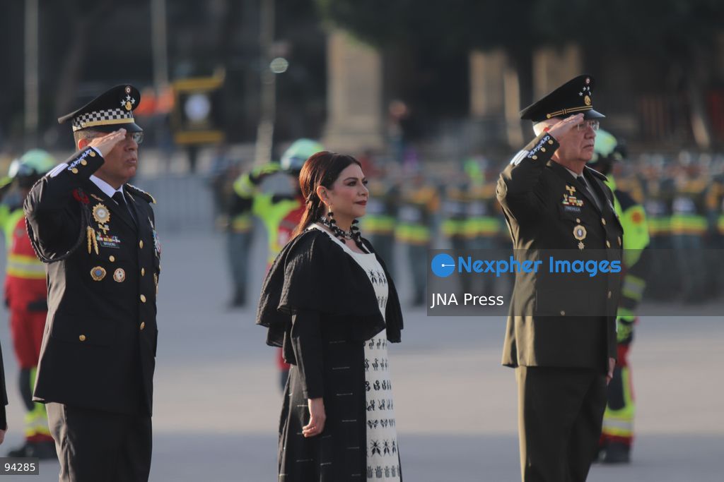 MEXICO CITY, MEXICO, SEPTEMBER 19, 2026: Mexican President Claudia Sheinbaum presides over a ceremony at the Zócalo in Mexico City as the national flag is raised to half-staff in memory of the victims of the September 19 earthquakes of 1985 and 2017. The ceremony included military honors and a moment of silence for those killed in the disasters. Photo by Carlos Santiago / JNA Press. (Photo by Carlos Santiago/JNA Press via Nexpher Images)