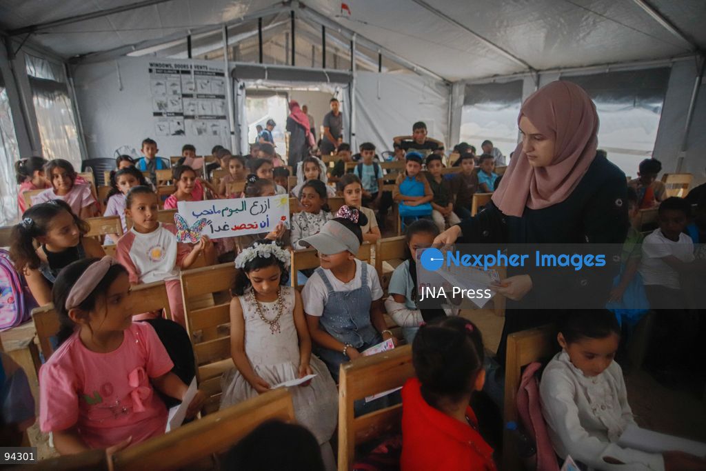 GAZA CITY, GAZA STRIP, SEPTEMBER 19, 2026: Palestinian students arrive at Al-Itqan School, operating from tents in the Al-Saftawi neighborhood of northern Gaza City, as the new academic year begins across the Gaza Strip. Education is resuming through schools and temporary learning spaces amid widespread damage to educational infrastructure and years of disruption caused by the war. Photo by Ramez Habboub / JNA Press. (Photo by Ramez Habboub/JNA Press via Nexpher Images)