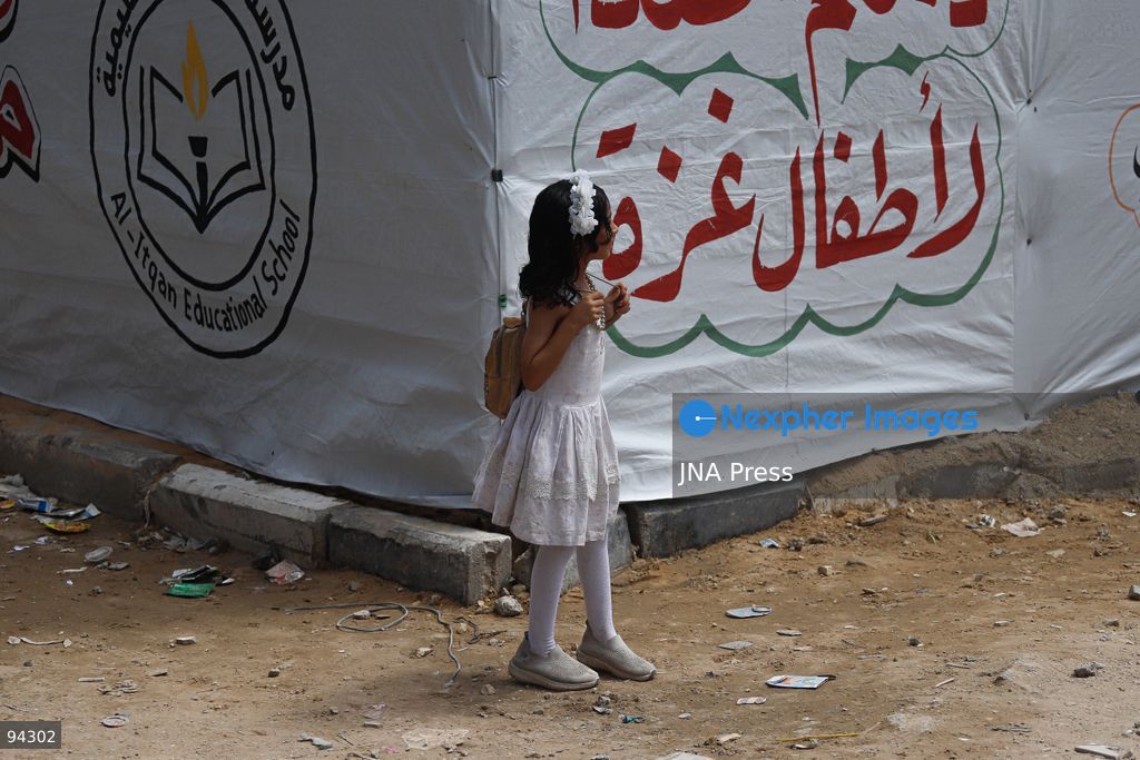 GAZA CITY, GAZA STRIP, SEPTEMBER 19, 2026: Palestinian students arrive at Al-Itqan School, operating from tents in the Al-Saftawi neighborhood of northern Gaza City, as the new academic year begins across the Gaza Strip. Education is resuming through schools and temporary learning spaces amid widespread damage to educational infrastructure and years of disruption caused by the war. Photo by Ramez Habboub / JNA Press. (Photo by Ramez Habboub/JNA Press via Nexpher Images)