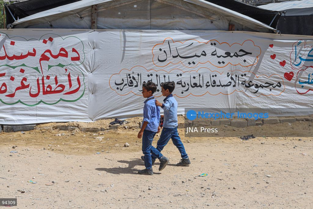 GAZA CITY, GAZA STRIP, SEPTEMBER 19, 2026: Palestinian students arrive at Al-Itqan School, operating from tents in the Al-Saftawi neighborhood of northern Gaza City, as the new academic year begins across the Gaza Strip. Education is resuming through schools and temporary learning spaces amid widespread damage to educational infrastructure and years of disruption caused by the war. Photo by Ramez Habboub / JNA Press. (Photo by Ramez Habboub/JNA Press via Nexpher Images)