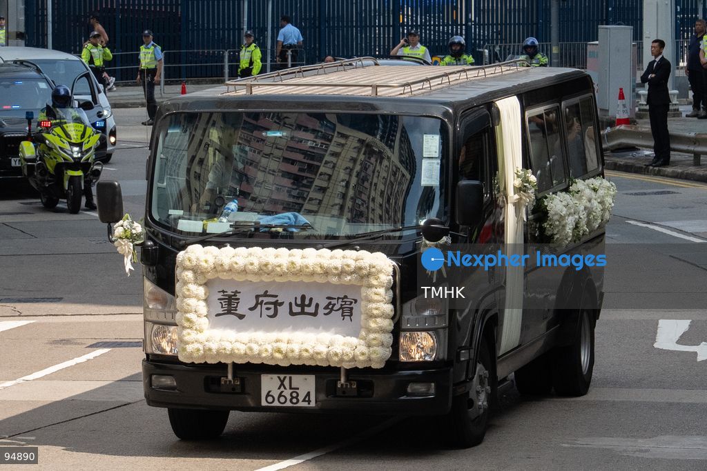 A telephoto view shows the hearse carrying the casket of former Chief Executive Tung Chee-hwa departing the Hong Kong Funeral Home for the crematorium on September 20, 2026 in Hong Kong. (Photo by Kevin Li/TMHK via Nexpher Images)