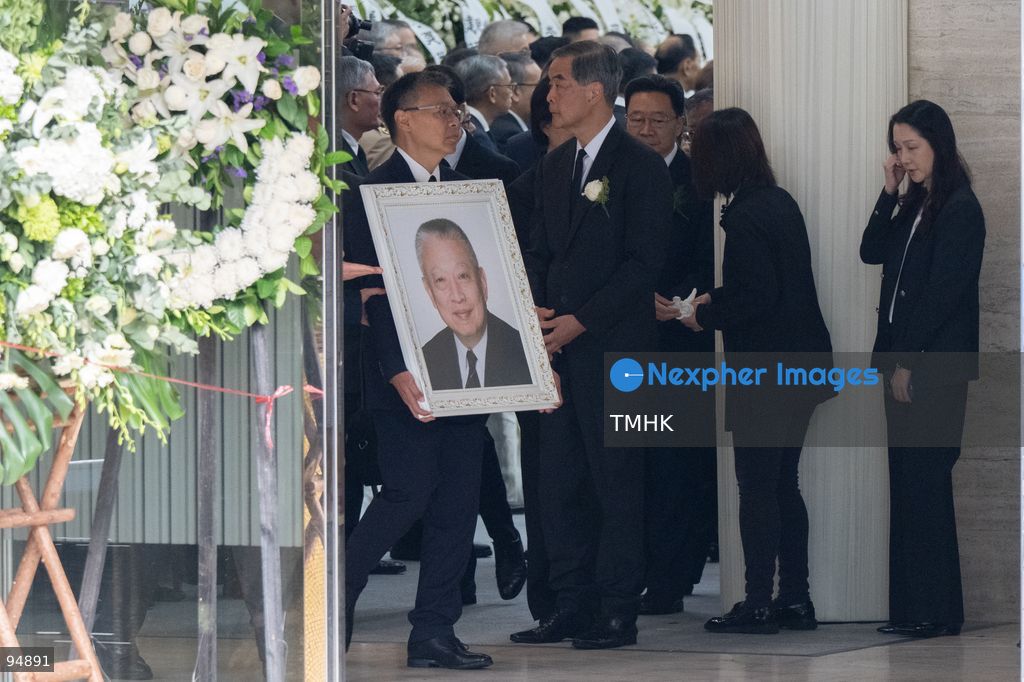 Andrew Tung Lieh-cheung, eldest son of the late former Chief Executive Tung Chee-hwa, holds his father's portrait as he walks out of the Hong Kong Funeral Home during the funeral procession on September 20, 2026 in Hong Kong. (Photo by Kevin Li/TMHK via Nexpher Images)