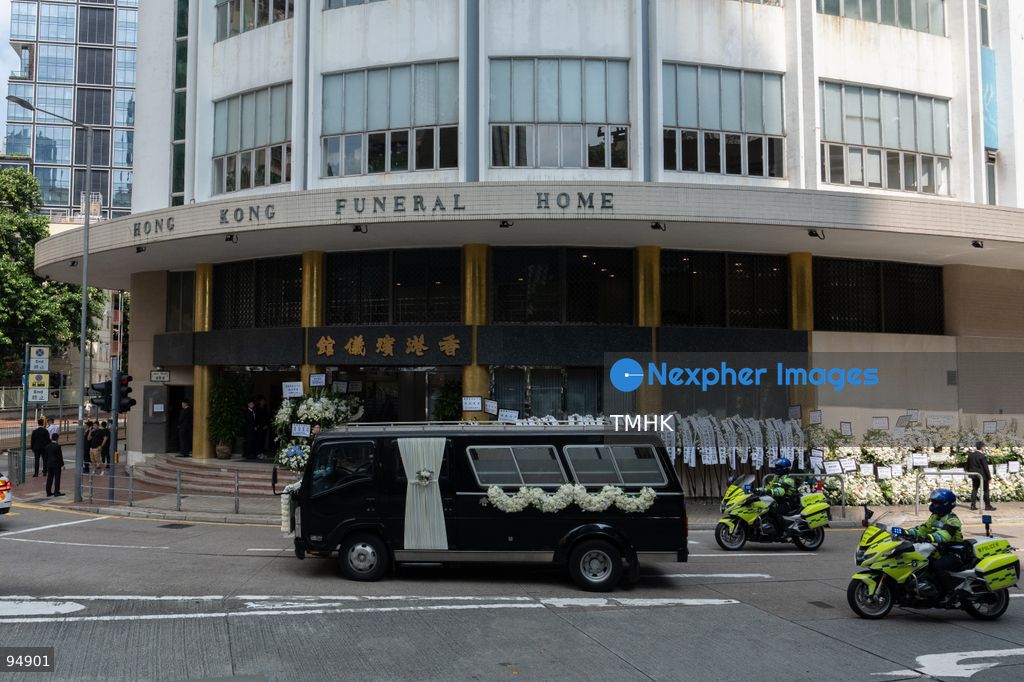 A wide view shows the hearse carrying the casket of former Chief Executive Tung Chee-hwa passing in front of the Hong Kong Funeral Home as it begins its journey to the crematorium on September 20, 2026 in Hong Kong. (Photo by Kevin Li/TMHK via Nexpher Images)