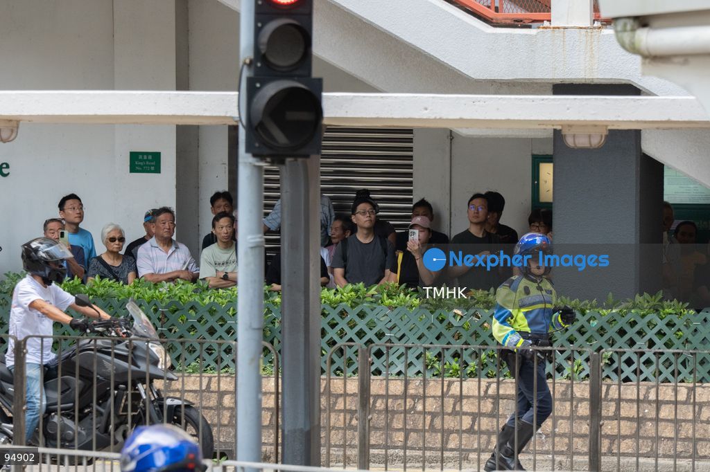 Members of the public gather along the pavement and tram tracks outside Model Housing Estate across King's Road to pay their final respects as the funeral of former Chief Executive Tung Chee-hwa takes place at the Hong Kong Funeral Home on September 20, 2026 in Hong Kong. (Photo by Kevin Li/TMHK via Nexpher Images)