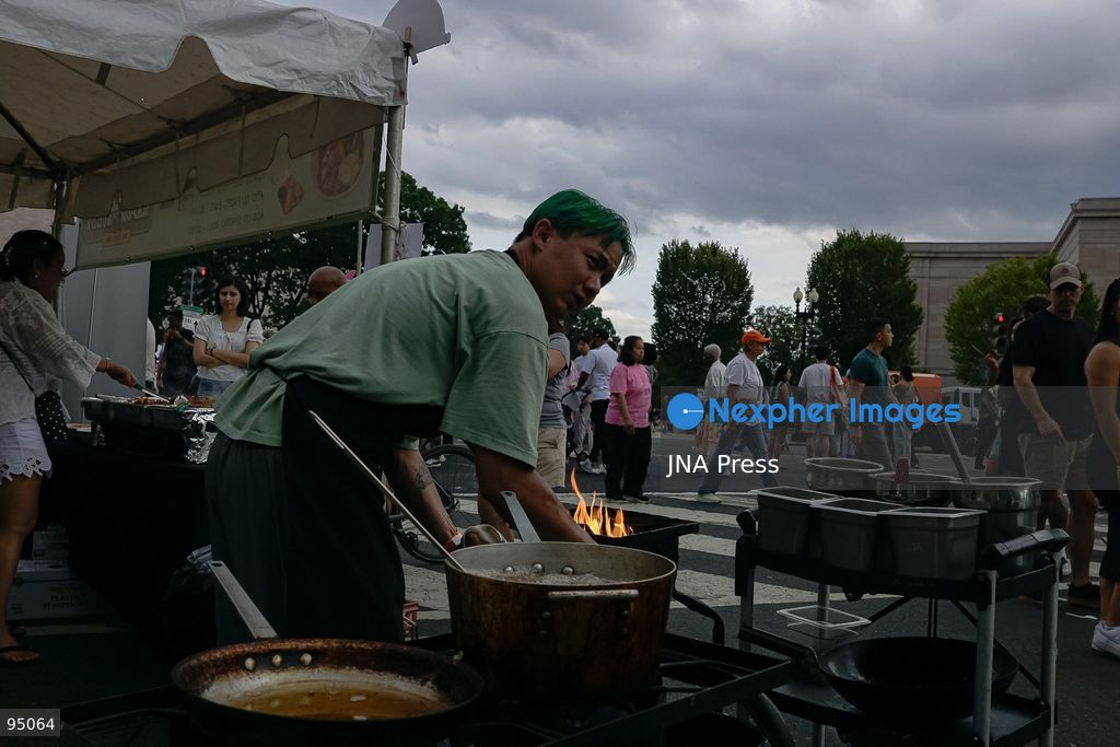 WASHINGTON, D.C., UNITED STATES, SEPTEMBER 19, 2026: Visitors queue to purchase traditional Thai food during the Sawasdee DC Thai Festival on Pennsylvania Avenue in Washington. The annual cultural festival showcases Thai cuisine, traditional and contemporary music, dance, Muay Thai, arts and other cultural activities while promoting Thai businesses and cultural exchange in the United States. Photo by Ariel Peña / JNA Press. (Photo by Ariel Peña/JNA Press via Nexpher Images)