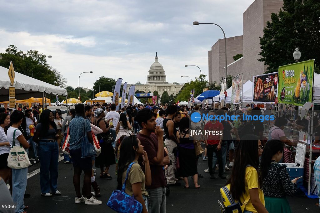 WASHINGTON, D.C., UNITED STATES, SEPTEMBER 19, 2026: Visitors queue to purchase traditional Thai food during the Sawasdee DC Thai Festival on Pennsylvania Avenue in Washington. The annual cultural festival showcases Thai cuisine, traditional and contemporary music, dance, Muay Thai, arts and other cultural activities while promoting Thai businesses and cultural exchange in the United States. Photo by Ariel Peña / JNA Press. (Photo by Ariel Peña/JNA Press via Nexpher Images)
