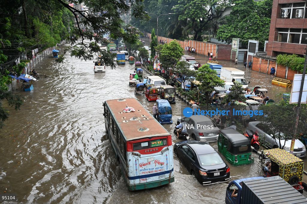 DHAKA, BANGLADESH, SEPTEMBER 20, 2026: Vehicles and passengers navigate waterlogged streets in Dhaka following heavy rainfall in the Bangladeshi capital. Floodwater submerged sections of roads across the city, disrupting traffic and making travel difficult for residents and commuters. Photo by Mamunur Rashid/ JNA Press. (Photo by Mamunur Rashid/JNA Press via Nexpher Images)