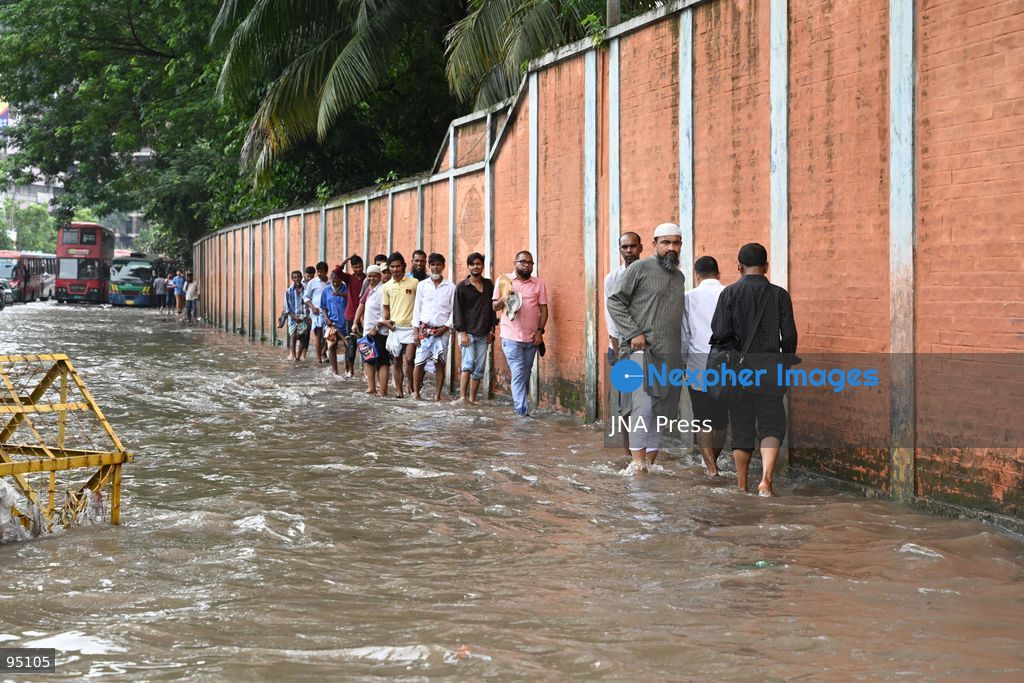 DHAKA, BANGLADESH, SEPTEMBER 20, 2026: Vehicles and passengers navigate waterlogged streets in Dhaka following heavy rainfall in the Bangladeshi capital. Floodwater submerged sections of roads across the city, disrupting traffic and making travel difficult for residents and commuters. Photo by Mamunur Rashid/ JNA Press. (Photo by Mamunur Rashid/JNA Press via Nexpher Images)
