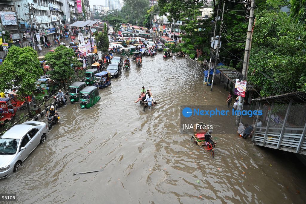 DHAKA, BANGLADESH, SEPTEMBER 20, 2026: Vehicles and passengers navigate waterlogged streets in Dhaka following heavy rainfall in the Bangladeshi capital. Floodwater submerged sections of roads across the city, disrupting traffic and making travel difficult for residents and commuters. Photo by Mamunur Rashid/ JNA Press. (Photo by Mamunur Rashid/JNA Press via Nexpher Images)