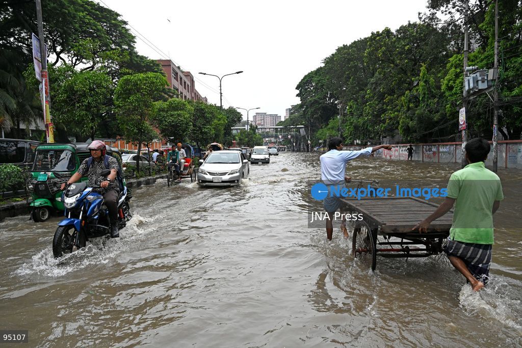 DHAKA, BANGLADESH, SEPTEMBER 20, 2026: Vehicles and passengers navigate waterlogged streets in Dhaka following heavy rainfall in the Bangladeshi capital. Floodwater submerged sections of roads across the city, disrupting traffic and making travel difficult for residents and commuters. Photo by Mamunur Rashid/ JNA Press. (Photo by Mamunur Rashid/JNA Press via Nexpher Images)