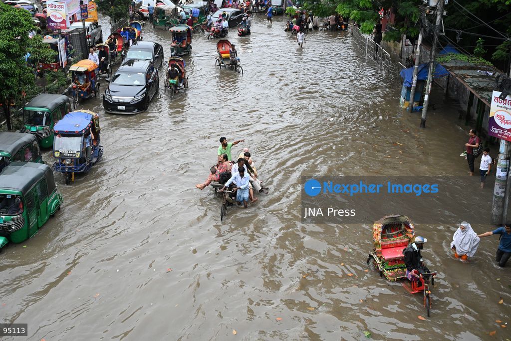 DHAKA, BANGLADESH, SEPTEMBER 20, 2026: Vehicles and passengers navigate waterlogged streets in Dhaka following heavy rainfall in the Bangladeshi capital. Floodwater submerged sections of roads across the city, disrupting traffic and making travel difficult for residents and commuters. Photo by Mamunur Rashid/ JNA Press. (Photo by Mamunur Rashid/JNA Press via Nexpher Images)