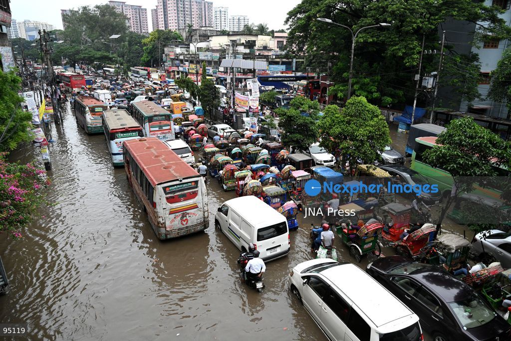 DHAKA, BANGLADESH, SEPTEMBER 20, 2026: Vehicles and passengers navigate waterlogged streets in Dhaka following heavy rainfall in the Bangladeshi capital. Floodwater submerged sections of roads across the city, disrupting traffic and making travel difficult for residents and commuters. Photo by Mamunur Rashid/ JNA Press. (Photo by Mamunur Rashid/JNA Press via Nexpher Images)
