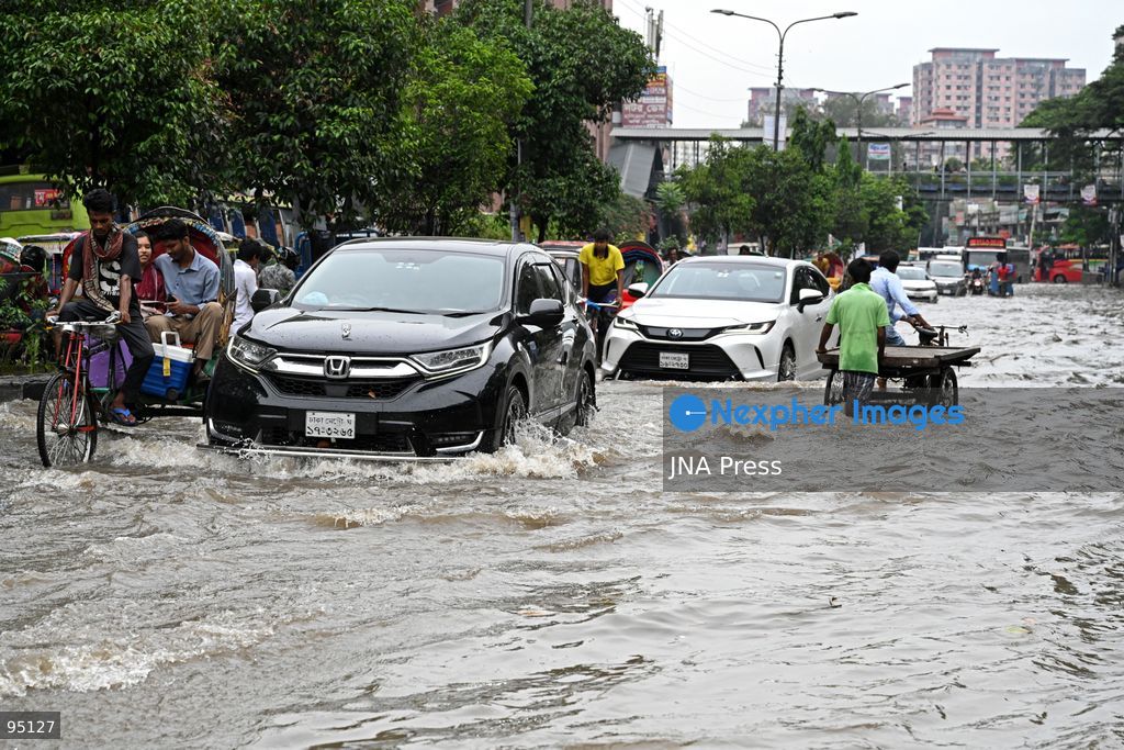 DHAKA, BANGLADESH, SEPTEMBER 20, 2026: Vehicles and passengers navigate waterlogged streets in Dhaka following heavy rainfall in the Bangladeshi capital. Floodwater submerged sections of roads across the city, disrupting traffic and making travel difficult for residents and commuters. Photo by Mamunur Rashid/ JNA Press. (Photo by Mamunur Rashid/JNA Press via Nexpher Images)