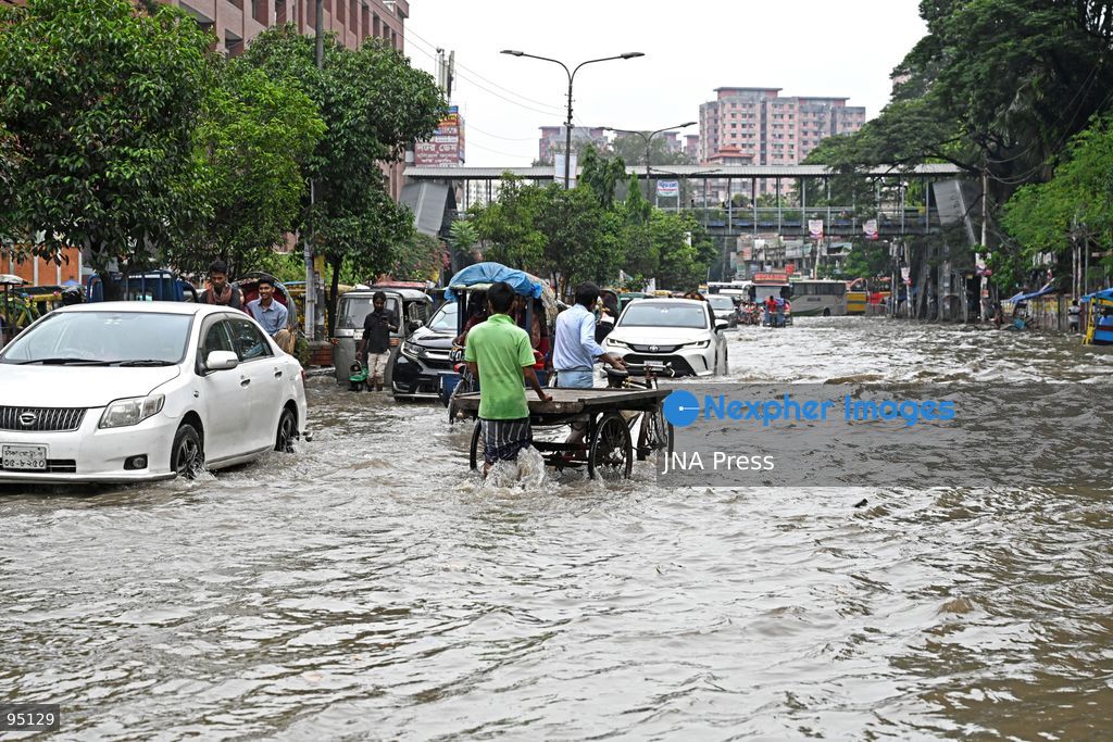 DHAKA, BANGLADESH, SEPTEMBER 20, 2026: Vehicles and passengers navigate waterlogged streets in Dhaka following heavy rainfall in the Bangladeshi capital. Floodwater submerged sections of roads across the city, disrupting traffic and making travel difficult for residents and commuters. Photo by Mamunur Rashid/ JNA Press. (Photo by Mamunur Rashid/JNA Press via Nexpher Images)