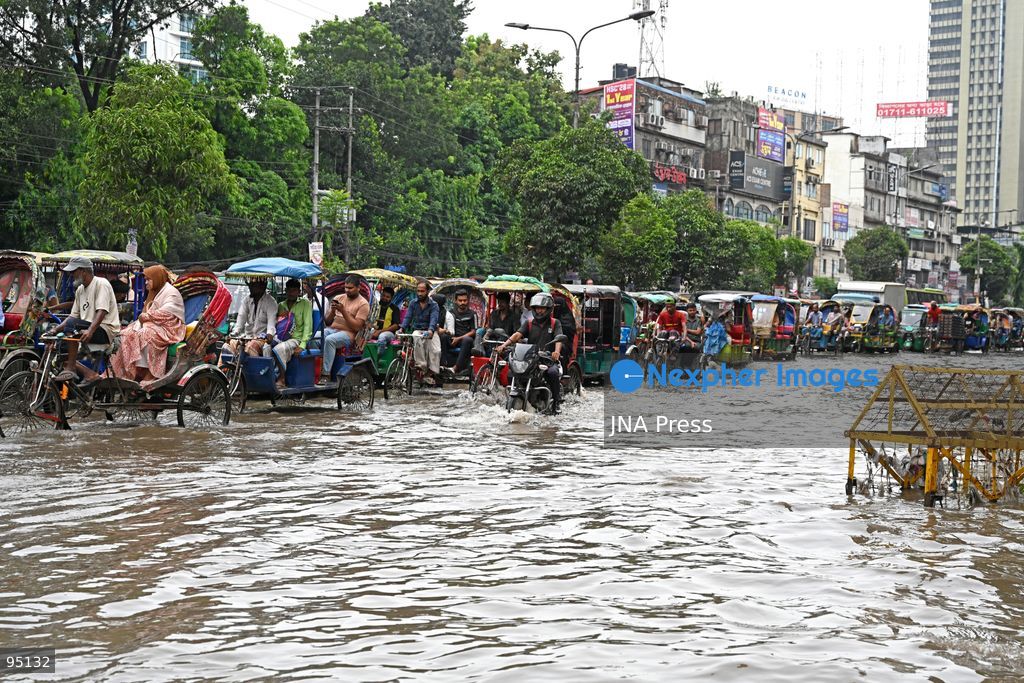 DHAKA, BANGLADESH, SEPTEMBER 20, 2026: Vehicles and passengers navigate waterlogged streets in Dhaka following heavy rainfall in the Bangladeshi capital. Floodwater submerged sections of roads across the city, disrupting traffic and making travel difficult for residents and commuters. Photo by Mamunur Rashid/ JNA Press. (Photo by Mamunur Rashid/JNA Press via Nexpher Images)