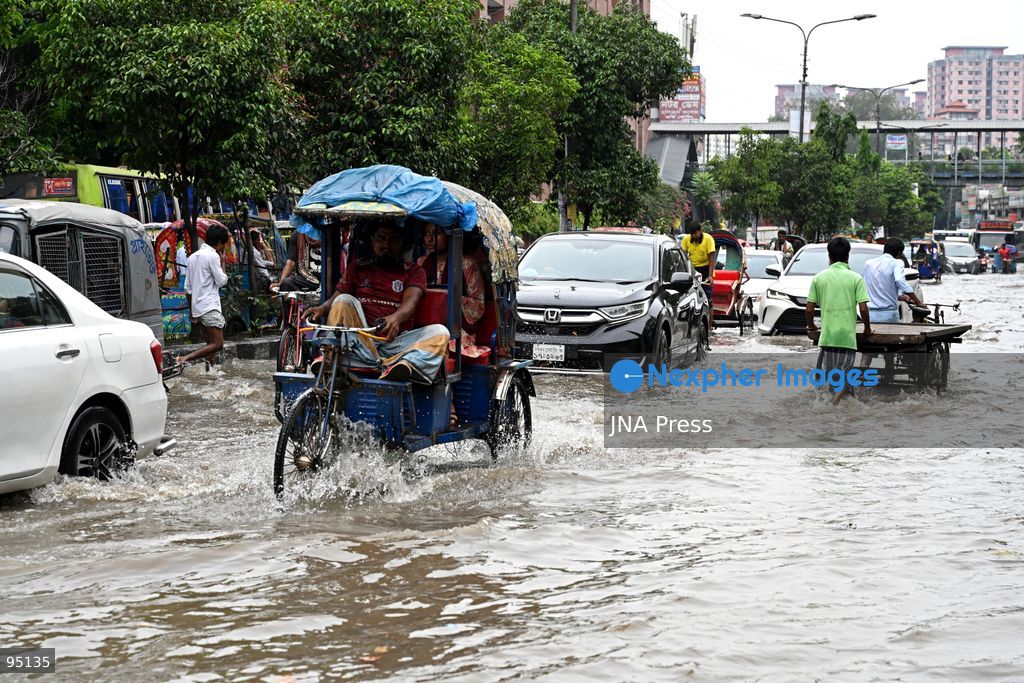 DHAKA, BANGLADESH, SEPTEMBER 20, 2026: Vehicles and passengers navigate waterlogged streets in Dhaka following heavy rainfall in the Bangladeshi capital. Floodwater submerged sections of roads across the city, disrupting traffic and making travel difficult for residents and commuters. Photo by Mamunur Rashid/ JNA Press. (Photo by Mamunur Rashid/JNA Press via Nexpher Images)