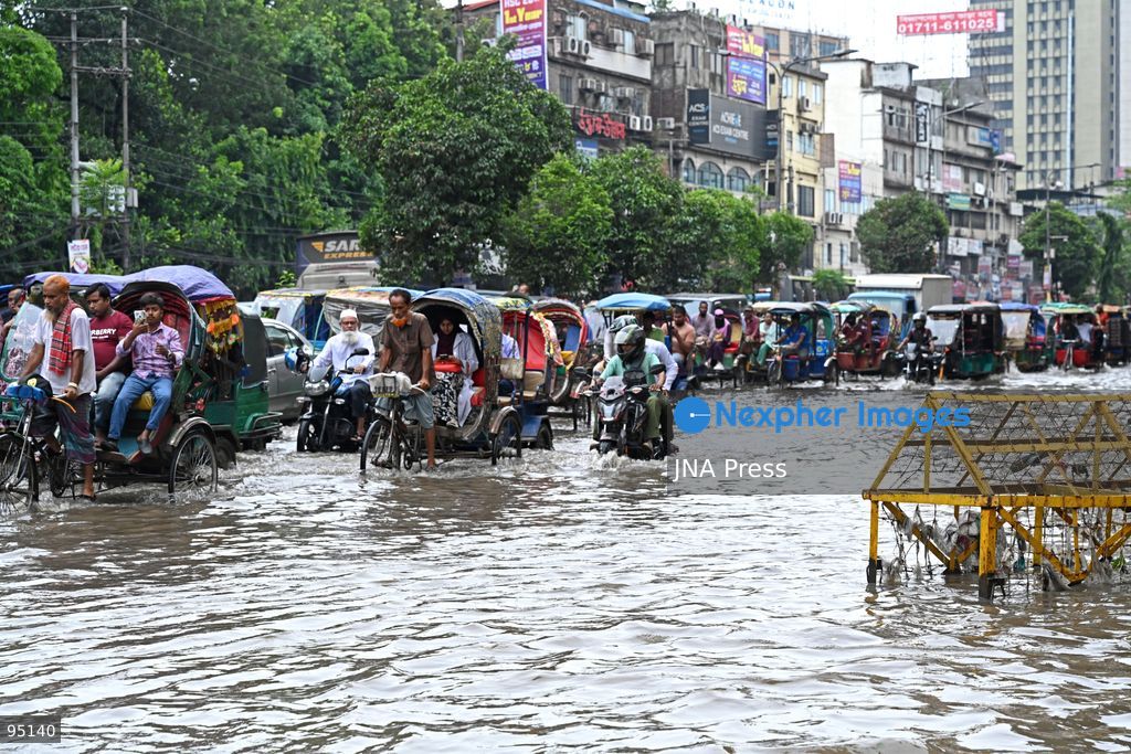 DHAKA, BANGLADESH, SEPTEMBER 20, 2026: Vehicles and passengers navigate waterlogged streets in Dhaka following heavy rainfall in the Bangladeshi capital. Floodwater submerged sections of roads across the city, disrupting traffic and making travel difficult for residents and commuters. Photo by Mamunur Rashid/ JNA Press. (Photo by Mamunur Rashid/JNA Press via Nexpher Images)