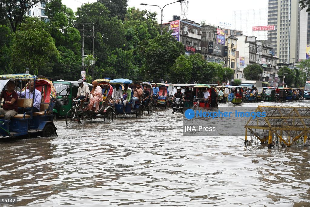 DHAKA, BANGLADESH, SEPTEMBER 20, 2026: Vehicles and passengers navigate waterlogged streets in Dhaka following heavy rainfall in the Bangladeshi capital. Floodwater submerged sections of roads across the city, disrupting traffic and making travel difficult for residents and commuters. Photo by Mamunur Rashid/ JNA Press. (Photo by Mamunur Rashid/JNA Press via Nexpher Images)