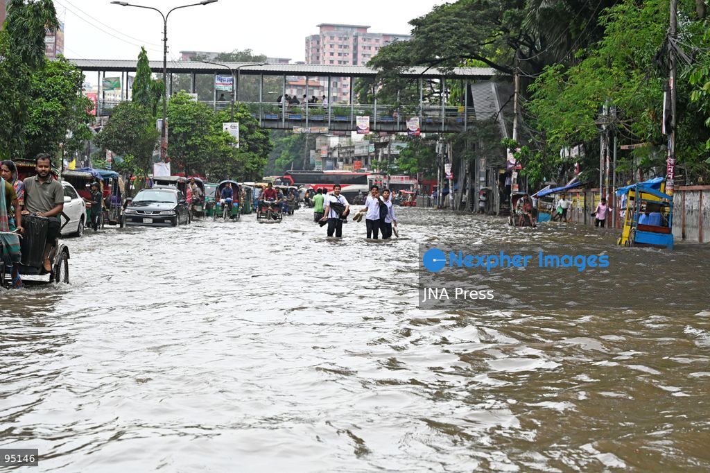 DHAKA, BANGLADESH, SEPTEMBER 20, 2026: Vehicles and passengers navigate waterlogged streets in Dhaka following heavy rainfall in the Bangladeshi capital. Floodwater submerged sections of roads across the city, disrupting traffic and making travel difficult for residents and commuters. Photo by Mamunur Rashid/ JNA Press. (Photo by Mamunur Rashid/JNA Press via Nexpher Images)