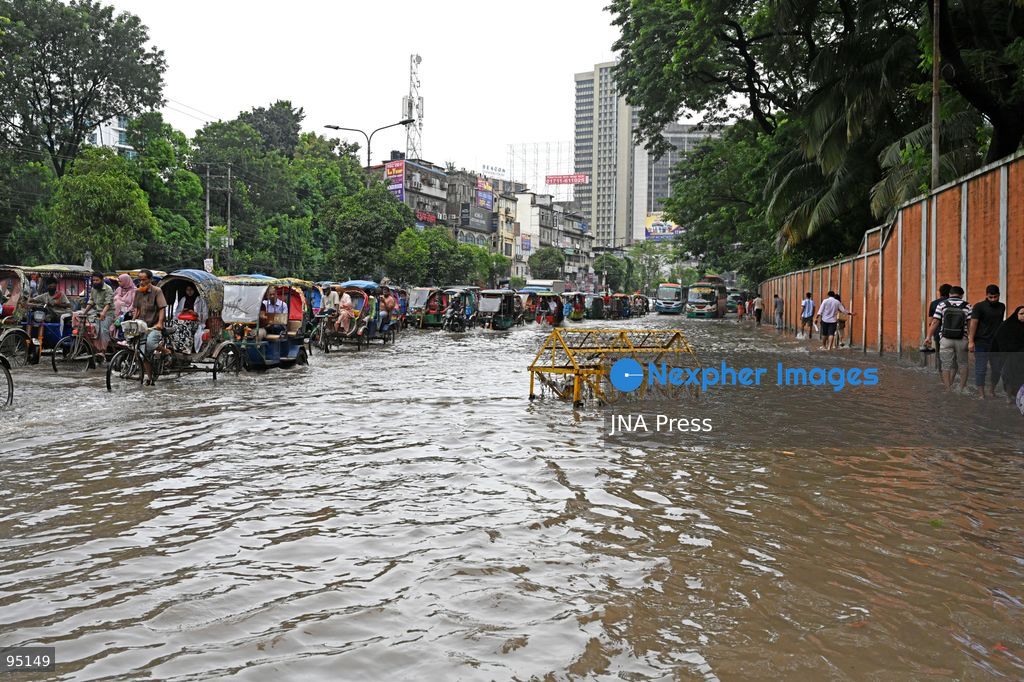 DHAKA, BANGLADESH, SEPTEMBER 20, 2026: Vehicles and passengers navigate waterlogged streets in Dhaka following heavy rainfall in the Bangladeshi capital. Floodwater submerged sections of roads across the city, disrupting traffic and making travel difficult for residents and commuters. Photo by Mamunur Rashid/ JNA Press. (Photo by Mamunur Rashid/JNA Press via Nexpher Images)