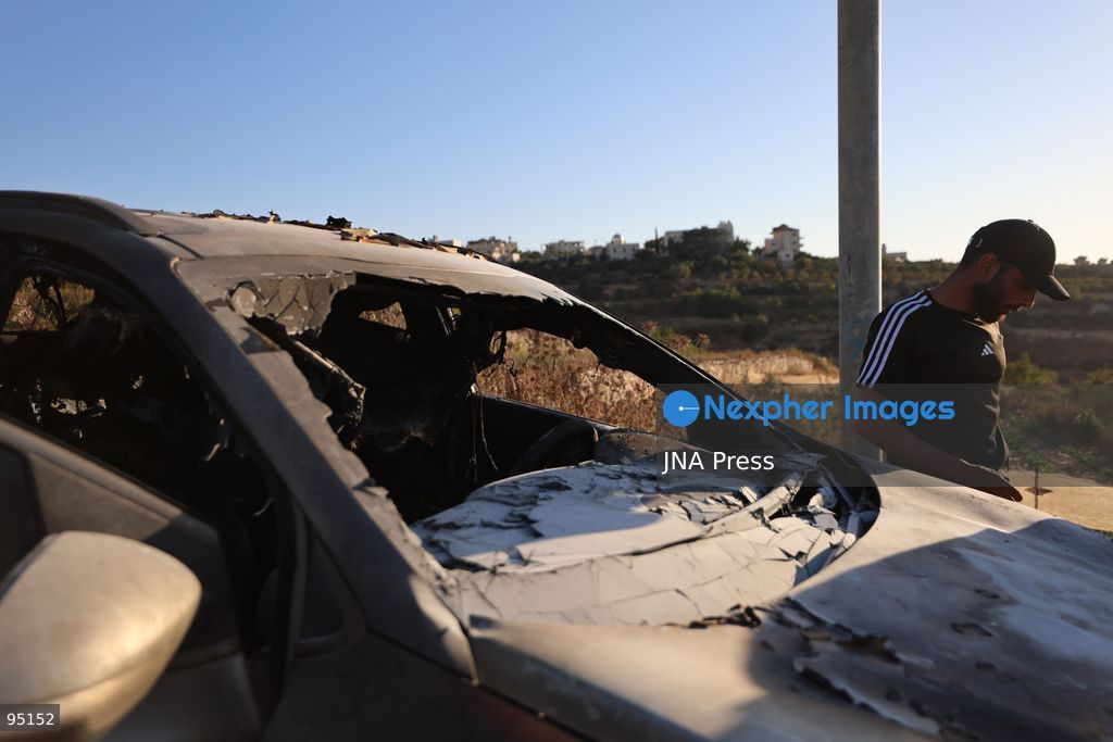 BEIT UMMAR, HEBRON, OCCUPIED WEST BANK, SEPTEMBER 20, 2026: Burned vehicles are seen following an attack by Israeli settlers in the town of Beit Ummar, north of Hebron. According to local sources, a Palestinian woman was injured and five vehicles were set on fire during the attack. Photo by Mosab Shawer / JNA Press. (Photo by Mosab shawer/JNA Press via Nexpher Images)