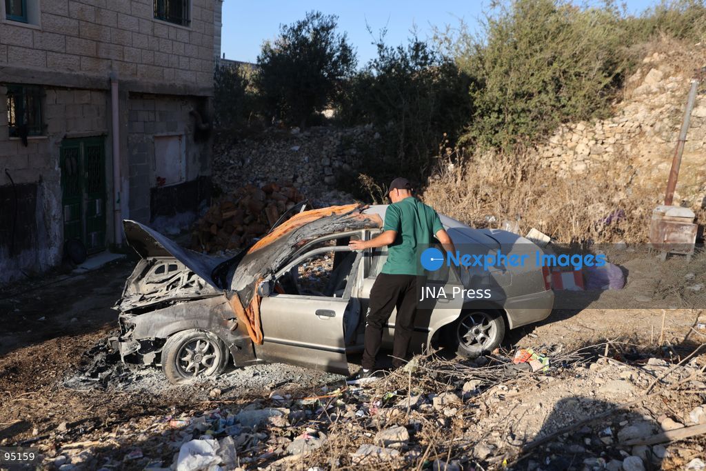 BEIT UMMAR, HEBRON, OCCUPIED WEST BANK, SEPTEMBER 20, 2026: Burned vehicles are seen following an attack by Israeli settlers in the town of Beit Ummar, north of Hebron. According to local sources, a Palestinian woman was injured and five vehicles were set on fire during the attack. Photo by Mosab Shawer / JNA Press. (Photo by Mosab shawer/JNA Press via Nexpher Images)