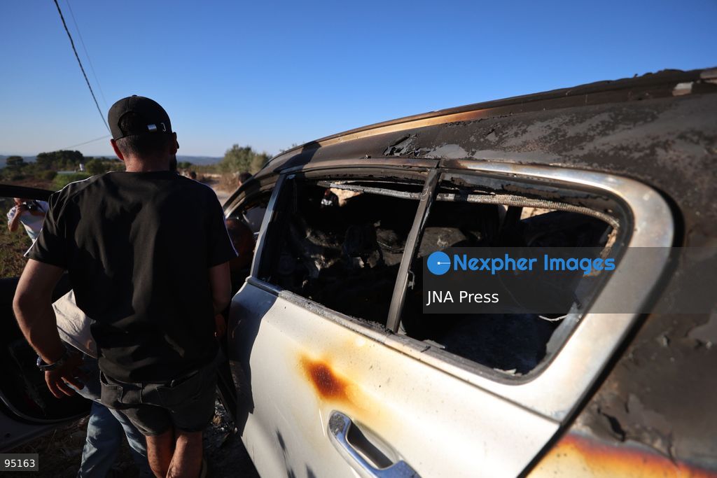 BEIT UMMAR, HEBRON, OCCUPIED WEST BANK, SEPTEMBER 20, 2026: Burned vehicles are seen following an attack by Israeli settlers in the town of Beit Ummar, north of Hebron. According to local sources, a Palestinian woman was injured and five vehicles were set on fire during the attack. Photo by Mosab Shawer / JNA Press. (Photo by Mosab shawer/JNA Press via Nexpher Images)