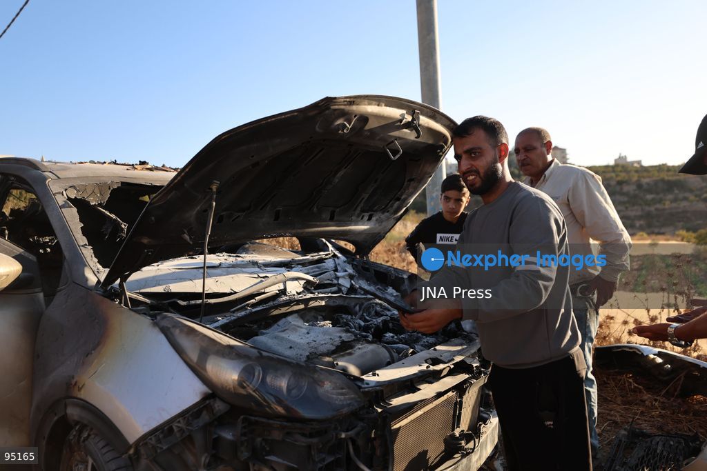 BEIT UMMAR, HEBRON, OCCUPIED WEST BANK, SEPTEMBER 20, 2026: Burned vehicles are seen following an attack by Israeli settlers in the town of Beit Ummar, north of Hebron. According to local sources, a Palestinian woman was injured and five vehicles were set on fire during the attack. Photo by Mosab Shawer / JNA Press. (Photo by Mosab shawer/JNA Press via Nexpher Images)