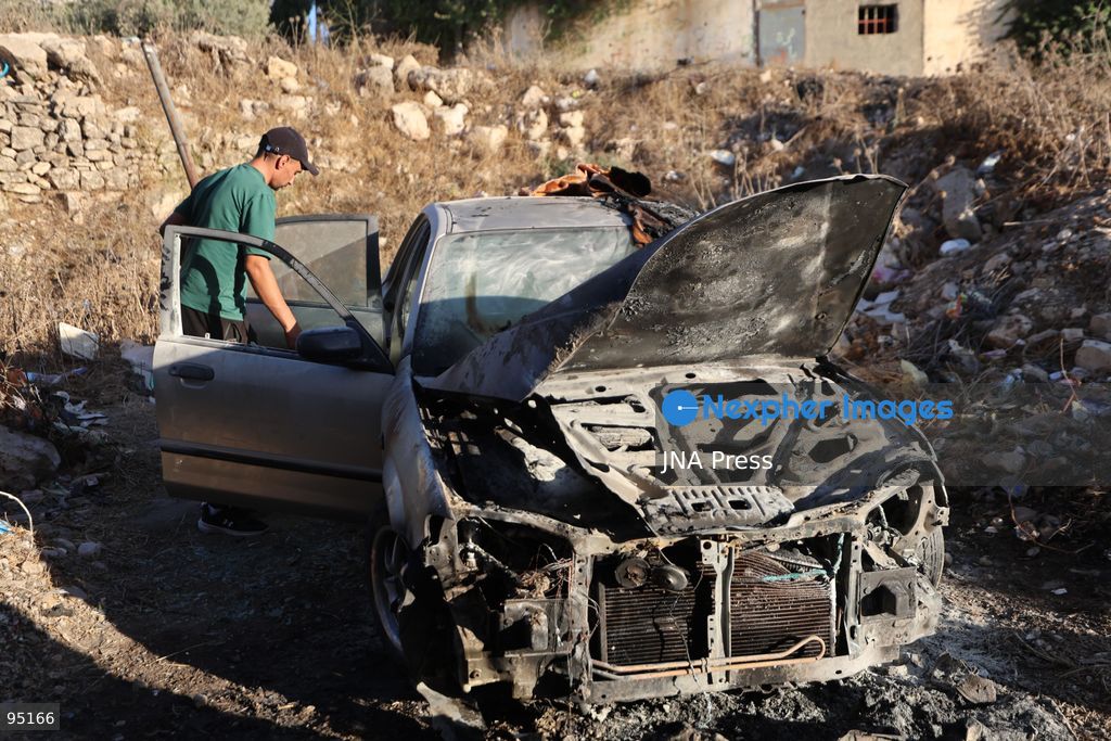 BEIT UMMAR, HEBRON, OCCUPIED WEST BANK, SEPTEMBER 20, 2026: Burned vehicles are seen following an attack by Israeli settlers in the town of Beit Ummar, north of Hebron. According to local sources, a Palestinian woman was injured and five vehicles were set on fire during the attack. Photo by Mosab Shawer / JNA Press. (Photo by Mosab shawer/JNA Press via Nexpher Images)