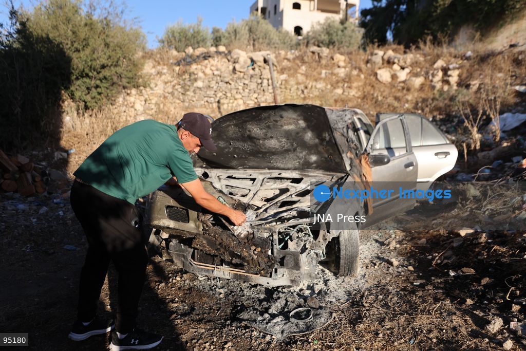 BEIT UMMAR, HEBRON, OCCUPIED WEST BANK, SEPTEMBER 20, 2026: Burned vehicles are seen following an attack by Israeli settlers in the town of Beit Ummar, north of Hebron. According to local sources, a Palestinian woman was injured and five vehicles were set on fire during the attack. Photo by Mosab Shawer / JNA Press. (Photo by Mosab shawer/JNA Press via Nexpher Images)