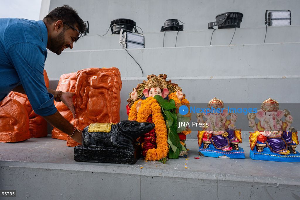 BANGKOK, THAILAND, SEPTEMBER 20, 2026: Hindu devotees worship a statue of Lord Ganesha during Ganesh Chaturthi celebrations near Bhumibol Bridge in Bangkok. The Hindu festival honors Ganesha, the deity associated with wisdom, prosperity and the removal of obstacles, and is observed with prayers, offerings and religious ceremonies. Photo by Watsawat Koktabtim / JNA Press. (Photo by Watsawat Koktabtim/JNA Press via Nexpher Images)