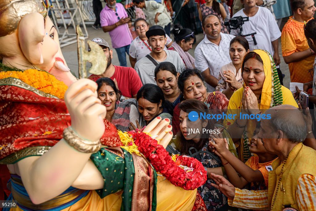 BANGKOK, THAILAND, SEPTEMBER 20, 2026: Hindu devotees worship a statue of Lord Ganesha during Ganesh Chaturthi celebrations near Bhumibol Bridge in Bangkok. The Hindu festival honors Ganesha, the deity associated with wisdom, prosperity and the removal of obstacles, and is observed with prayers, offerings and religious ceremonies. Photo by Watsawat Koktabtim / JNA Press. (Photo by Watsawat Koktabtim/JNA Press via Nexpher Images)